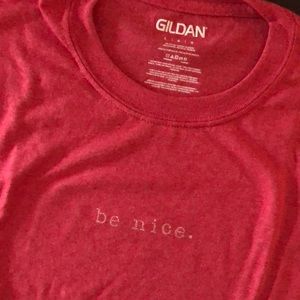 Custom made t-shirt with ‘be nice’ stamped on front.